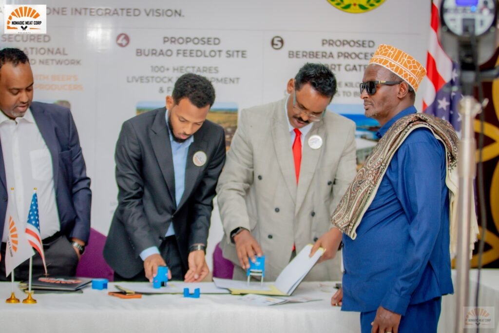 Participants signing documents at NMC’s July 27, 2026 event in Hargeisa